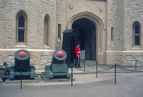 London, England, UK, 1975. Entrance to the Tower of London with guards. Also: two mortar.