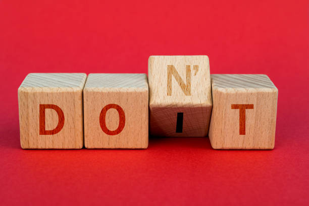 istock Wooden cubes with word don't and do it 1283163332