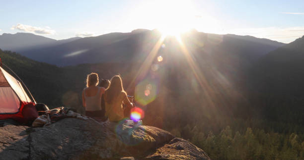 istock Young couple set up tent in mountains 1283165868