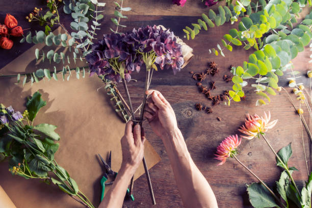 istock Florist hands creating a beautiful flower bouquet 1283167113