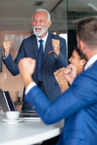 istock Group of business persons in discussion. Working together. 1283171281