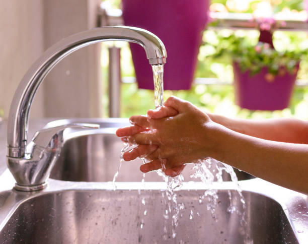 istock Child is washing hands with antibacterial soap - Covid-19 virus disease prevention 1283171633