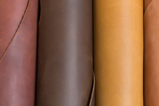 istock Brown and light brown leather rolls. Can be used as background in art or design projects. 1283171697