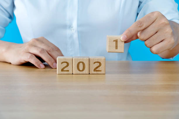 istock Wooden cubes with word 2021 1283172564