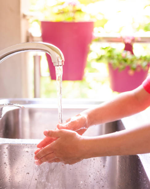istock Child is washing hands with antibacterial soap - Covid-19 virus disease prevention 1283172768