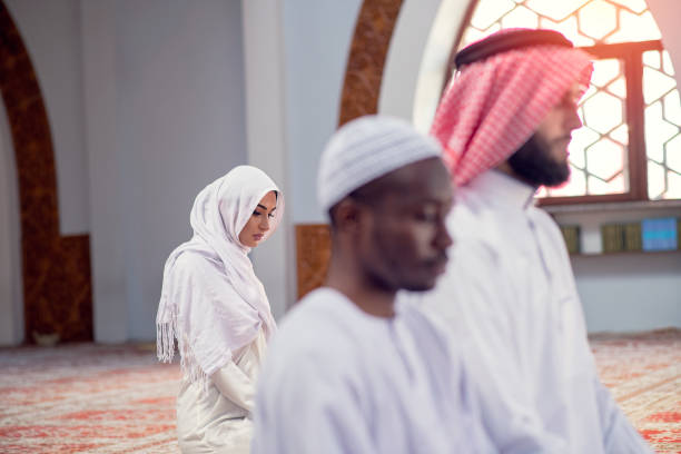 istock Muslim Couple Praying inside of beautiful mosque 1283177457