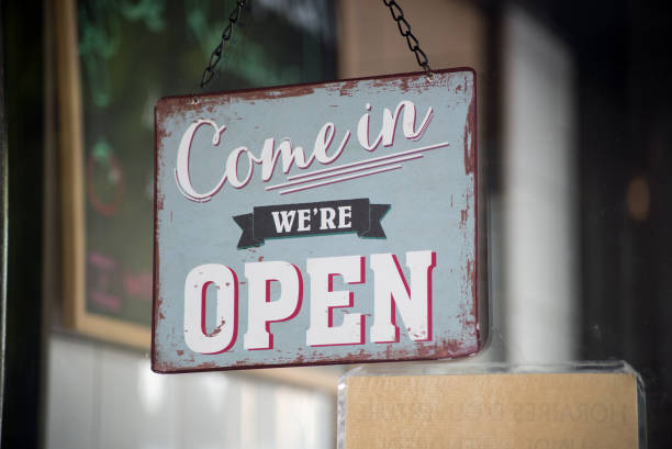 istock vintage signboard come in we are open on store front 1283177465