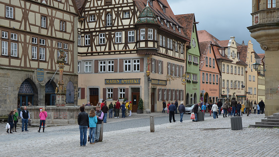 Rothenburg, Germany, May 12, 2013 - The busy market place in Rothenburg ob der Tauber, Bavaria at lunchtime