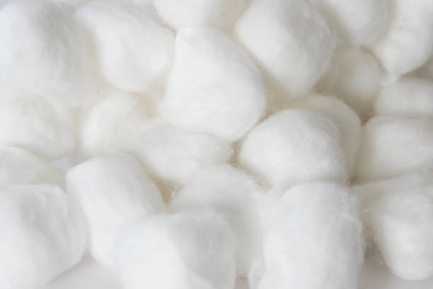 Cotton balls on white background. stock photo