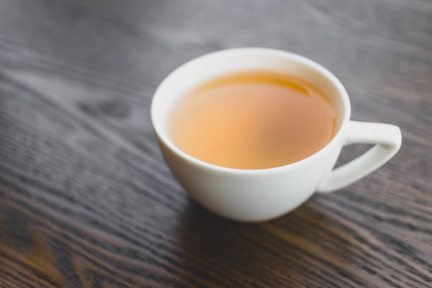 istock hot tea in white ceramic cup on vintage wooden table 1283179530