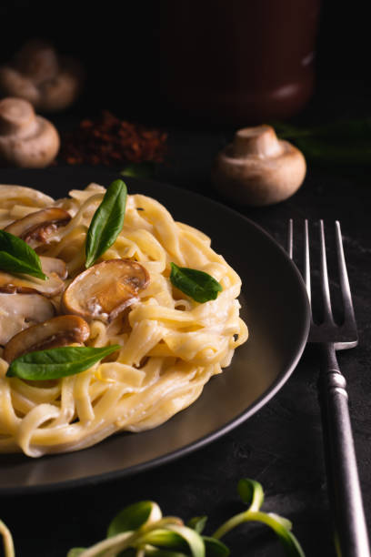 istock Italian pasta with creamy sauce and mushrooms 1283179634