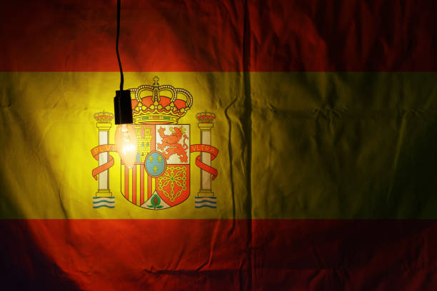 istock Flag of Spain illuminated by a lamp 1283181149