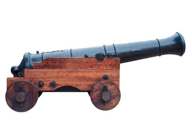 istock Ancient cannon on wheels isolated on white 1283181999