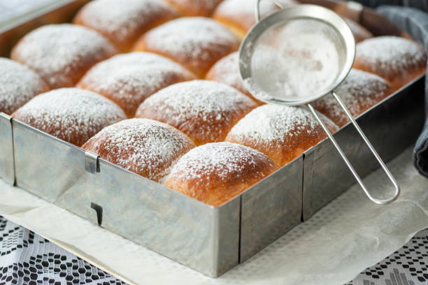 istock Sweet bread rolls with powdered sugar on top 1283182335