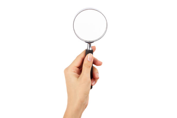 istock Magnifying glass in the hand, isolated 1283183303