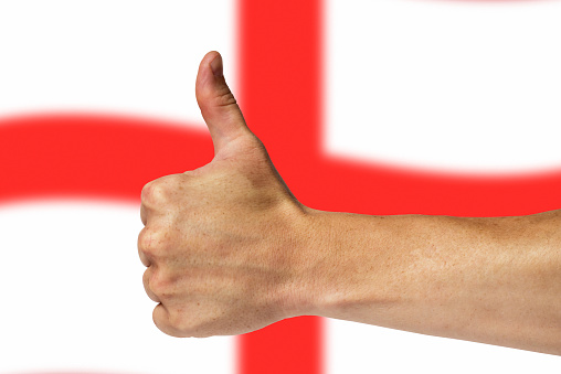 Thumbs up on a background of a flag of England