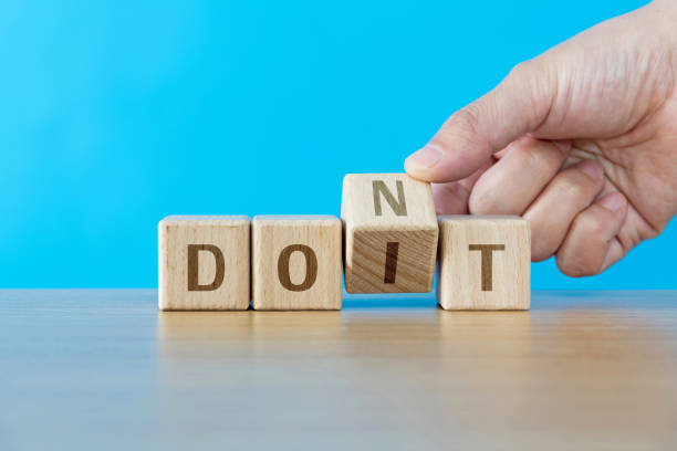 istock Wooden cubes with word don't and do it 1283187368