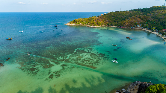 Aerial view drone uav top down birds eye view blue water and coral reef at Koh Tao Thailand by Drone High angle view