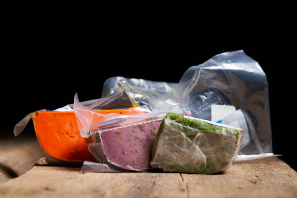 istock Three different gourmet cheeses on rough woode planks 1283189470