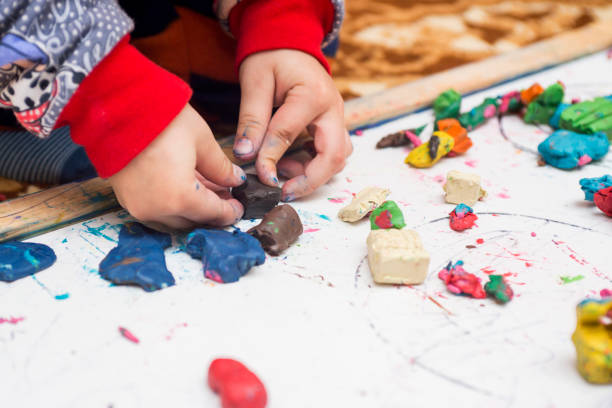istock Child playing with clay. Kid activity in kindergarten or at home 1283194047