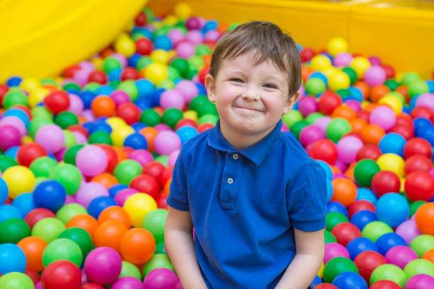 istock Funny boy grimacing. Child at playground 1283194243