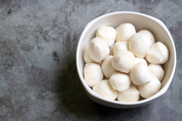 istock Boiled fish balls in white bowl on marble table background. 1283198645