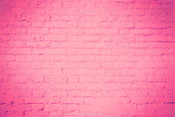 istock Texture of a wall made of old bricks. toned pink 1283200733
