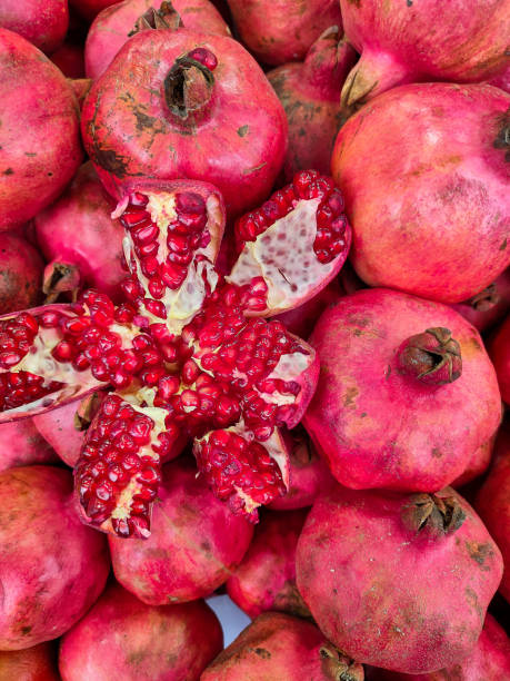 istock Fresh natural fruit pomegranate on a shop counter 1283201120