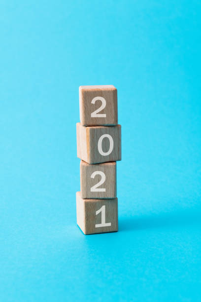 istock Wooden cubes with word 2021 1283202446