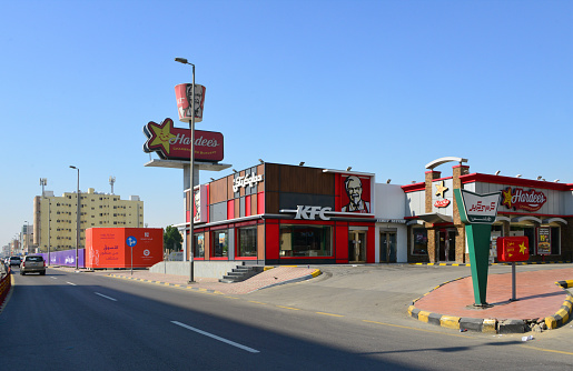 Dammam, Eastern Province, Saudi Arabia: KFC and Hardee's - fast food restaurants on King Fahd Road, Al Badiyah.