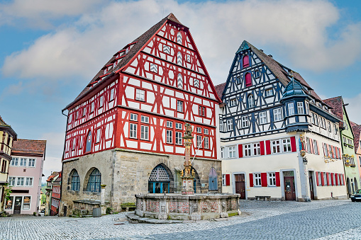 Timber framed houses and  St George's fountain in Rothenburg ob der Tauber, medieval town, Germany