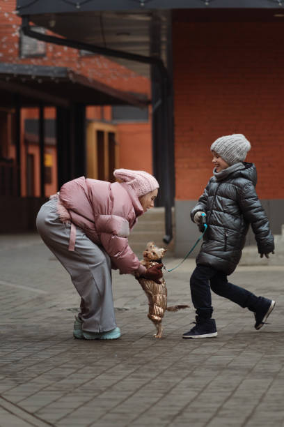 istock Happy family on walk the dog 1283205928