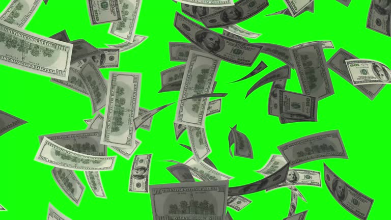 Raining money stock video over green screen chroma key background