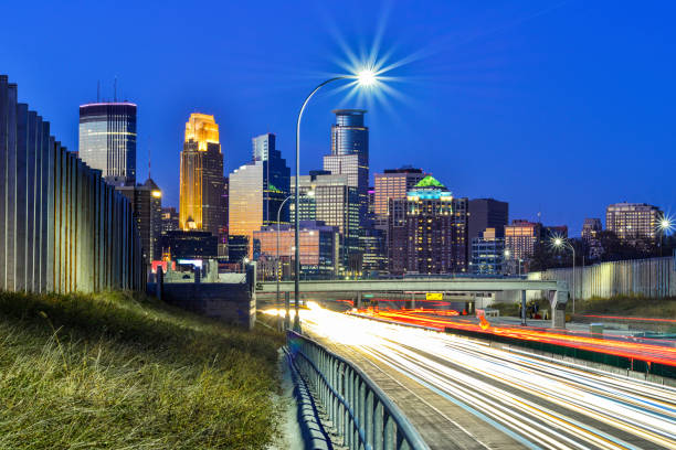 istock Minneapolis Skyline and Light Trails from Traffic at Sunset 1283207146