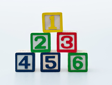 Wooden toy blocks with number 123456.