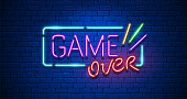 Game Over. Neon Text Sign with a Brick Wall Background. Illustration.