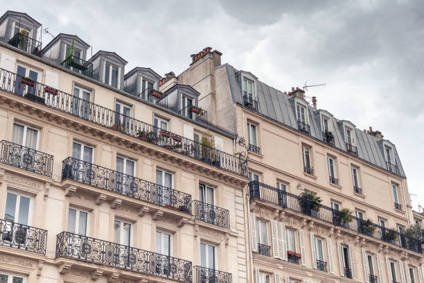 istock Beautiful Paris building facade with windows and balconies 1283209664