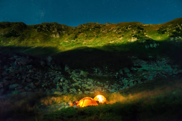 istock Two tents at night in mountains 1283212225