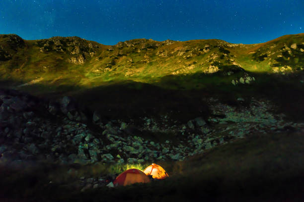 istock Two tents at night in mountains 1283212277