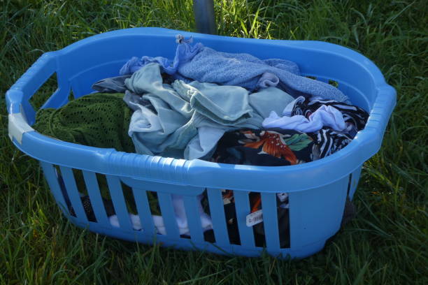 istock laundry basket on the floor waiting to be extended 1283213144