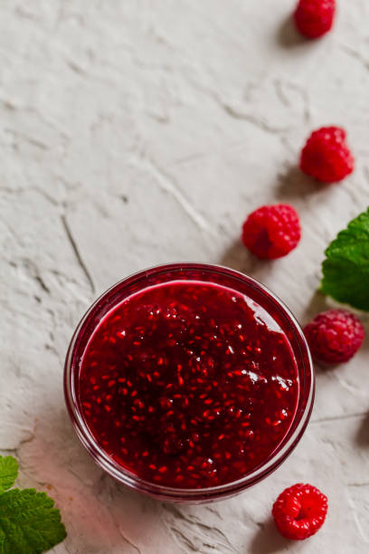 istock homemade raspberry jam on a concrete background with fresh raspberries, selective focus 1283213352