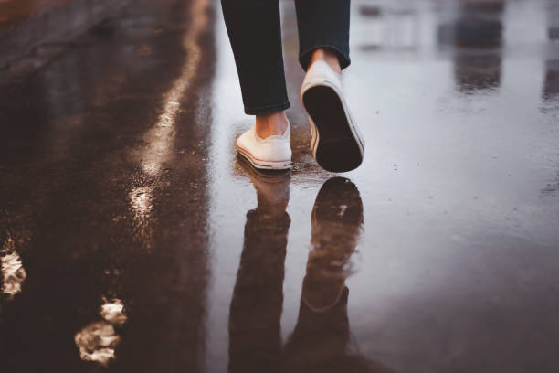 istock Woman in raining season 1283214151