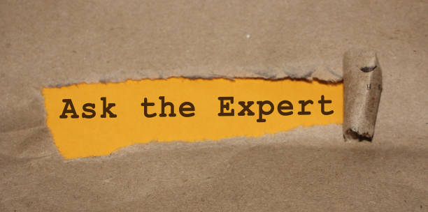istock The text ASK AN EXPERT appearing behind torn brown paper. Professional opinion education concept 1283214837