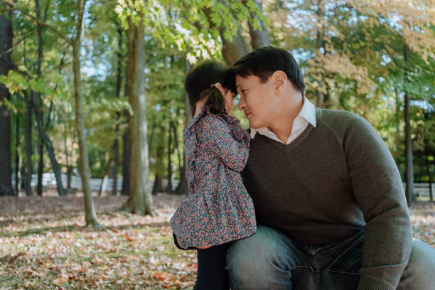 istock Asian family having fun in nature in Autumn 1283215500