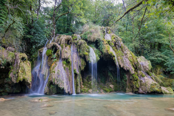 istock Jura Tufs waterfall, with its show limestone sculptures 1283215560