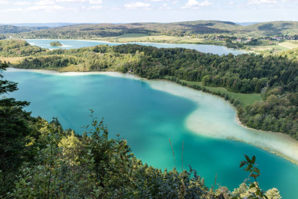 Top view of the 4 lakes of the Frasnois village, Jura Top view of the 4 lakes of the Frasnois village, Jura, France jura stock pictures, royalty-free photos & images