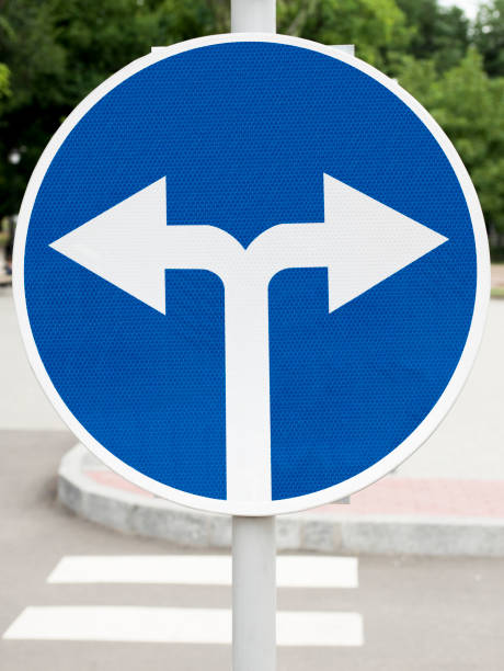 istock road sign, turn on the street 1283217382