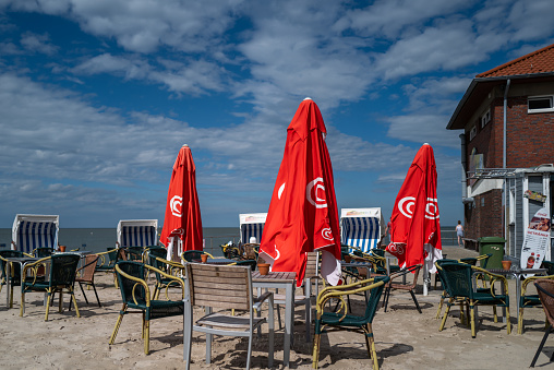 Hooksiel, Germany - August 21, 2020: Umbrellas at the beach of Hooksiel