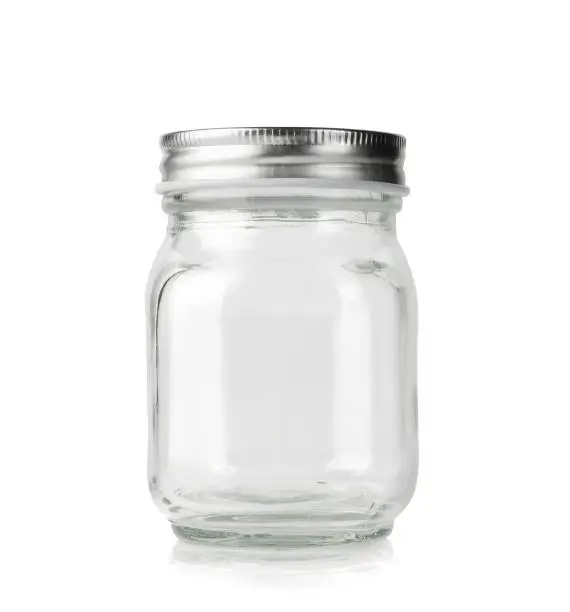 Empty mason jar with silver cap isolated on white background