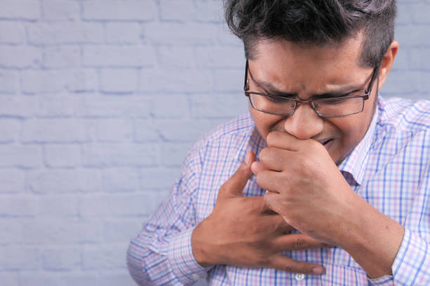 istock sick man with sneezes and coughs 1283219951